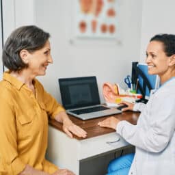 Woman consulting with an audiologist about hearing loss.