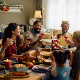 Happy family toasting for holiday dinner