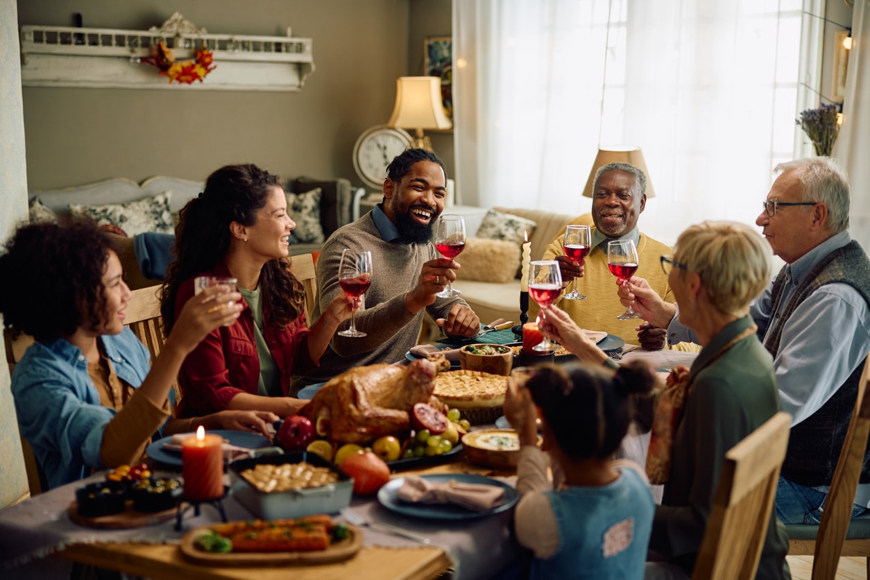 Happy family toasting for holiday dinner.