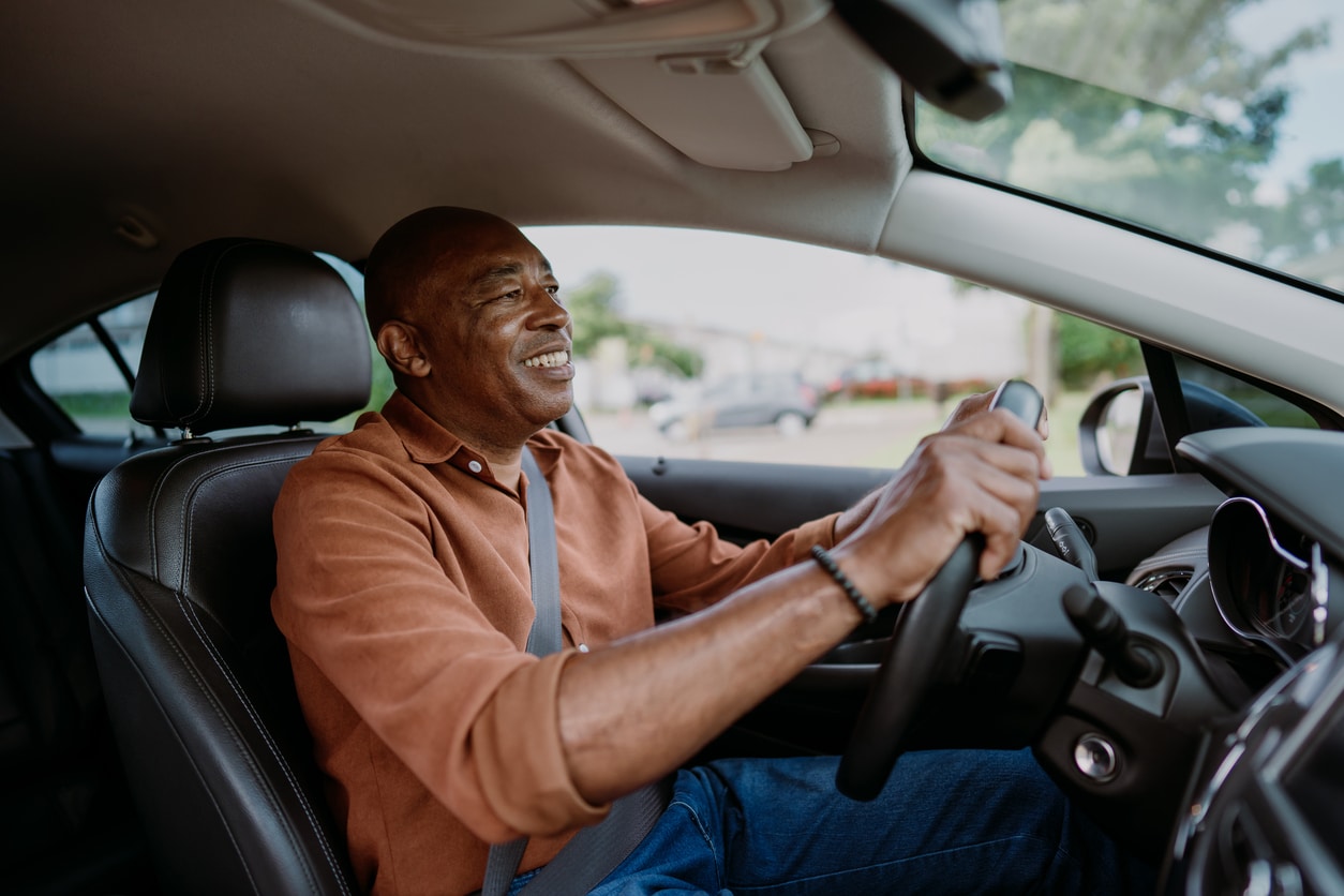 Happy man driving his car.