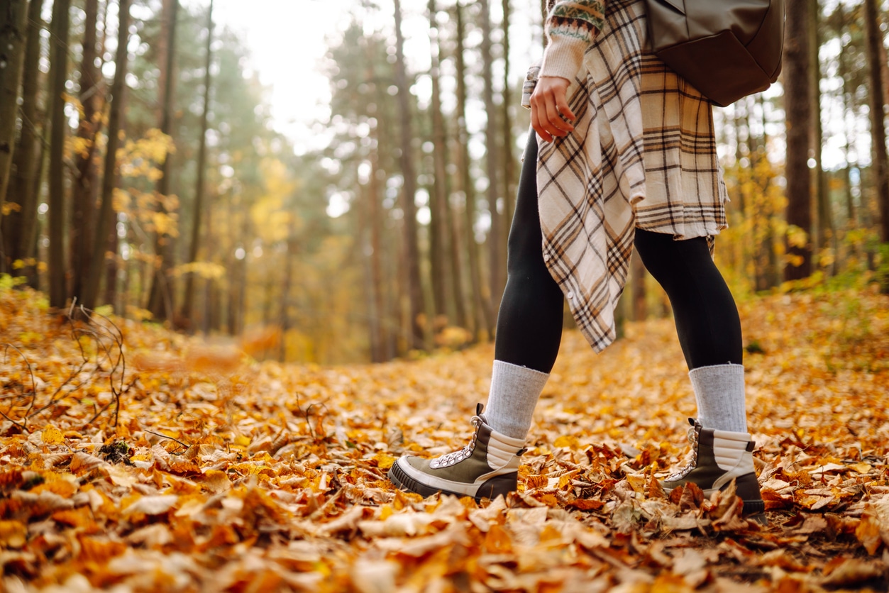 Person takes hike in autumn