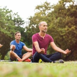 Yoga and meditation group practice in the park